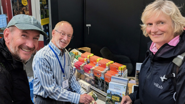 Bill and Denise Stenning getting stamped by Tony Dale - Richmond Info Centre